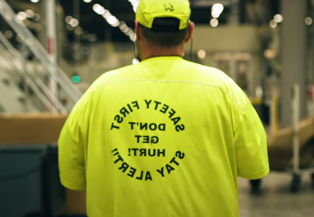 An IP employee wears a bright yellow 安全ty first t-shirt